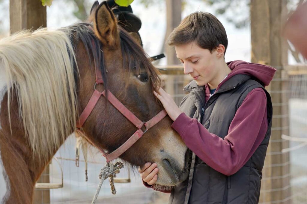 Teen boy with horse